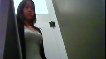 Hidden camera films beautiful MILF in a changing room