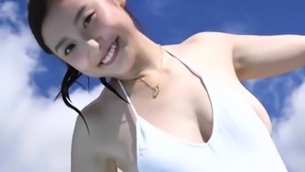 Asian babe makes a one piece swimsuit look so damn good