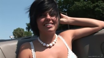 Exotic tattooed brunette displaying her tits lovely in reality shoot outdoor