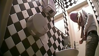 Fine white shiny booty of a stranger girl filmed in the toilet