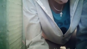 White brunette lady in the public toilet room pisses and wipes her pussy