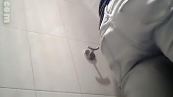 White chick in white pants pisses in the public restroom