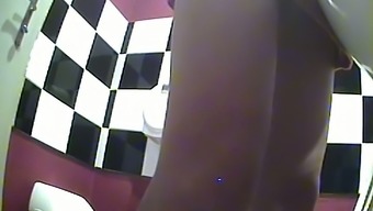 Brunette sexy lean girl in the public cafe restroom