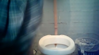 Blonde stranger milf in orange dress pisses in the toilet room