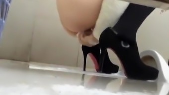 Woman in high heels caught in public toilet pissing