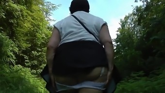 Upskirt bum in the woods Part One.mp4