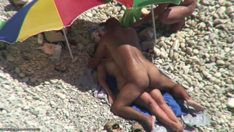 Tanned man fucks his wife on a nudist beach. Spy video