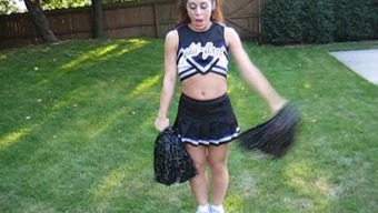 A sweet cheerleader flashes her titties whereas in her uniform