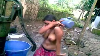 Dirty Indian village girl is soaping her tit outdoor