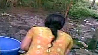 Indian village girl is changing her clothes outdoor