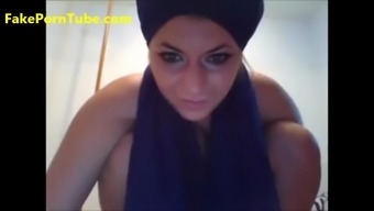 Sexy busty Arabian babe fisting her pussy in front of webcam