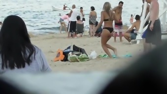 Drunk blond girl gets dirty on beach