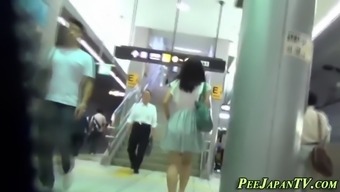 asian female pees in wc