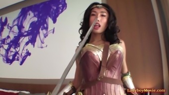 Gorgeous Thai shemale in a Wonder Woman cosplay outfit upskirts