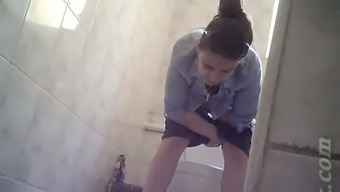 Cute brunette white girl in tight short pisses in the toilet