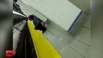 Wicked purple-haired babe makes water at the subway