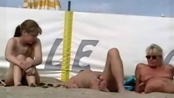 Nudist beach voyeur watches sexy babes enjoying the sun