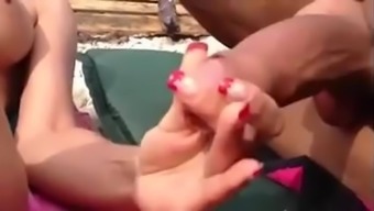 Beach handjob into her hand
