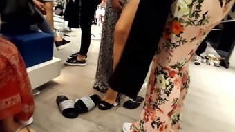 her split sexy long legs feets show at shopping