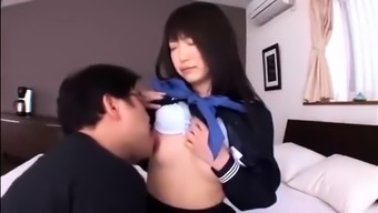 Dazzling Asian schoolgirl in uniform enjoys a hard fucking