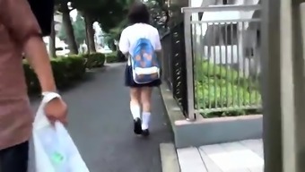 Lovely Japanese schoolgirl in tight panties voyeur upskirt