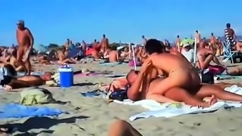 Amateur swingers enjoying hardcore group sex on the beach