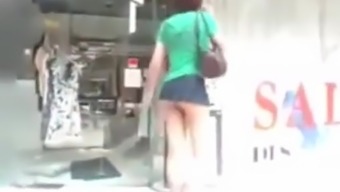 Japanese girl shopping in Tokyo in mini skirt