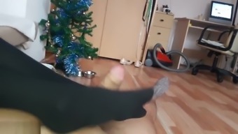 Footjob. Girl whith pretty legs in pantyhose masturbating smooth dick