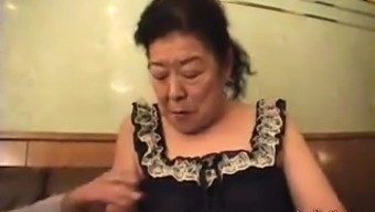 Horny Japanese granny enjoys an intense fucking on the bed 