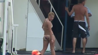 Amateur babes in bikinis dance and get crazy on a yacht