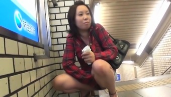 Asian teenager peeing