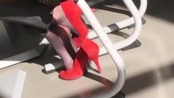 secretary in nylon socks and red high heels