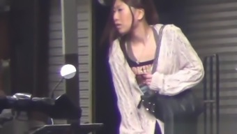 Bizarre asian slut peeing in public