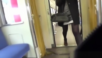 Asian peeing on train