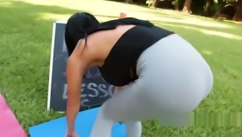 Latina yoga teacher bangs outdoor