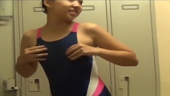 Asians in locker room change into swimsuits