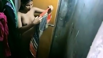 Indian teen with lovely boobs takes a shower on hidden cam