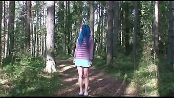 Emo looking chick with blue hair flashes butt as she pees outdoors