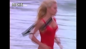 Busty babe Pamela Anderson running in her iconic red Baywatch swimsuit