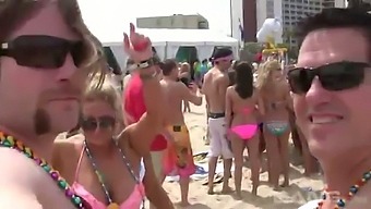 Horny chicks in sexy bikinis getting wild with each other on the beach
