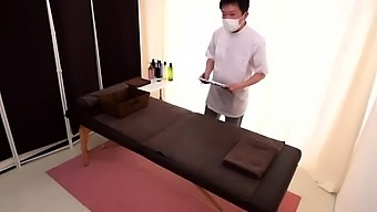 Luscious Japanese wife sexually satisfied on a massage table