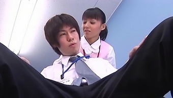 Japanese nurse Aino Kishi drops on her knees to suck a dick