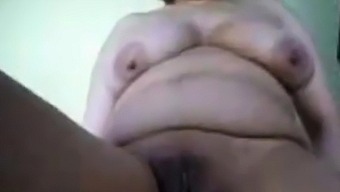 Arabian granny fingering her pussy and ass on cam