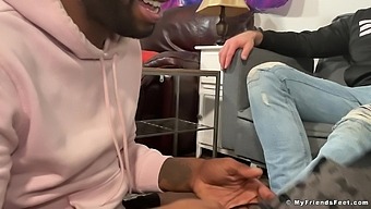 Naughty black guy makes a friend happy by licking his bare feet