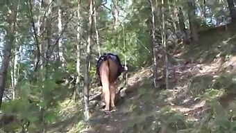 Under a skirt without panties. Hairy pussy and big ass in a short dress climbs mountains in nature.