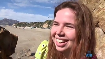 Cute redhead teen Alina West flashing her tight pussy on the beach