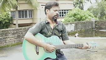 DESI COUPLE SINGING WITH GUITER IN ROOF (OUTDOOR)