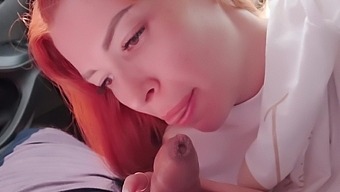 Amateur POV video of a shy redhead sucking a dick in the car