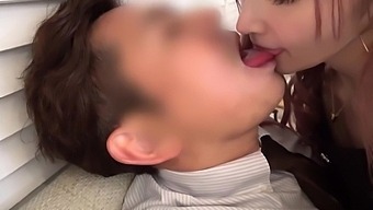 Sweet Japanese teen kissing her co-worker before quick sex in doggy pose