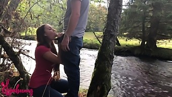 A guy cheats on his wife with a brunette outdoors